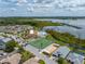 Aerial view of community with lake and tennis courts at 462 Sweetwater Way, Haines City, FL 33844