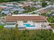 Community pool and recreation area with shuffleboard at 462 Sweetwater Way, Haines City, FL 33844