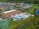 Community pool and tennis courts near clubhouse at 462 Sweetwater Way, Haines City, FL 33844