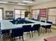 Community room with tables perfect for meetings or events at 462 Sweetwater Way, Haines City, FL 33844