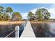 Long dock extending over calm water, offering scenic views at 462 Sweetwater Way, Haines City, FL 33844