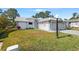 Charming single-story home with well-maintained lawn, clean exterior and landscaped front yard at 462 Sweetwater Way, Haines City, FL 33844