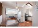 Galley kitchen with white cabinets and black appliances at 462 Sweetwater Way, Haines City, FL 33844