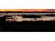 Tranquil lake view at sunset from a lakeside dock at 462 Sweetwater Way, Haines City, FL 33844