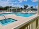 Community pool area with multiple pools and a spa at 462 Sweetwater Way, Haines City, FL 33844