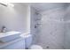 Clean bathroom with white vanity and marble shower at 520 S 10Th St, Lake Wales, FL 33853
