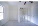 Empty bedroom with tile floors and mirrored closet at 520 S 10Th St, Lake Wales, FL 33853