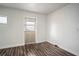 Simple bedroom with wood-look floors and exterior access at 520 S 10Th St, Lake Wales, FL 33853