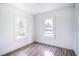 Simple bedroom with two windows and wood-look flooring at 520 S 10Th St, Lake Wales, FL 33853