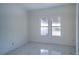 Bright bedroom with white walls and marble-style floors at 520 S 10Th St, Lake Wales, FL 33853