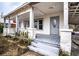 Inviting front porch with wooden floors and railings at 520 S 10Th St, Lake Wales, FL 33853