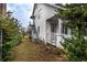Side view of the house with stairs and yard at 520 S 10Th St, Lake Wales, FL 33853