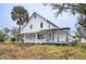 White two-story house with back deck and yard at 520 S 10Th St, Lake Wales, FL 33853