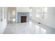 Bright living room with marble flooring and a fireplace at 520 S 10Th St, Lake Wales, FL 33853
