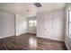 Living room showcasing wood flooring and a closet at 520 S 10Th St, Lake Wales, FL 33853
