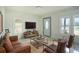 Living area with leather couches and a coffee table at 520 S 10Th St, Lake Wales, FL 33853