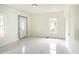Bright living room with white walls and marble-style floors at 520 S 10Th St, Lake Wales, FL 33853