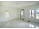 Living room featuring marble floors and a front door at 520 S 10Th St, Lake Wales, FL 33853