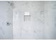 Clean shower with marble tile and niche at 520 S 10Th St, Lake Wales, FL 33853