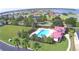 Community pool and clubhouse with lake view at 537 Pond Cypress Ct, Auburndale, FL 33823