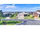 Houses with three-car garages, paved driveways, and landscaping at 537 Pond Cypress Ct, Auburndale, FL 33823
