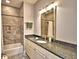 Elegant bathroom with granite countertop and tiled shower at 537 Pond Cypress Ct, Auburndale, FL 33823
