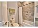 Clean bathroom with a tub, shower, and granite countertop at 537 Pond Cypress Ct, Auburndale, FL 33823