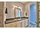 Bathroom with a granite vanity and a separate toilet area at 537 Pond Cypress Ct, Auburndale, FL 33823