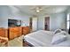Lovely bedroom with king bed, dresser and ensuite bathroom at 537 Pond Cypress Ct, Auburndale, FL 33823