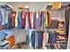Walk-in closet with ample hanging space and shelving at 537 Pond Cypress Ct, Auburndale, FL 33823