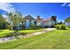 Community clubhouse with red tile roof at 537 Pond Cypress Ct, Auburndale, FL 33823