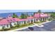Community clubhouse with red roof and lake view at 537 Pond Cypress Ct, Auburndale, FL 33823