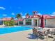Community pool and clubhouse with patio at 537 Pond Cypress Ct, Auburndale, FL 33823