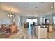 Bright dining area with wood table and view into living area at 537 Pond Cypress Ct, Auburndale, FL 33823