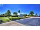 Community entrance with landscaping and signage at 537 Pond Cypress Ct, Auburndale, FL 33823