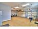 Large garage with overhead storage and multiple bikes at 537 Pond Cypress Ct, Auburndale, FL 33823