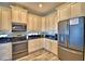 Well-equipped kitchen with stainless steel appliances at 537 Pond Cypress Ct, Auburndale, FL 33823