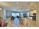 Open concept kitchen with island and stainless steel appliances at 537 Pond Cypress Ct, Auburndale, FL 33823