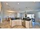 Large kitchen island with granite countertop and ample cabinet space at 537 Pond Cypress Ct, Auburndale, FL 33823