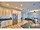 Modern kitchen with stainless steel appliances and granite countertops at 537 Pond Cypress Ct, Auburndale, FL 33823