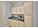 Well-equipped kitchenette with granite countertops and ample cabinetry at 537 Pond Cypress Ct, Auburndale, FL 33823