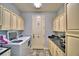 Laundry room with built-in cabinets and a granite countertop at 537 Pond Cypress Ct, Auburndale, FL 33823