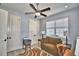 Bright home office with a desk, chair, and ample natural light at 537 Pond Cypress Ct, Auburndale, FL 33823