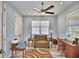Home office featuring a comfortable armchair and built-in desk at 537 Pond Cypress Ct, Auburndale, FL 33823
