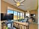 Bright screened lanai with multiple seating areas and views at 537 Pond Cypress Ct, Auburndale, FL 33823