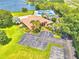 Aerial view of community clubhouse and tennis courts at 608 Sweet Bay Cir, Winter Haven, FL 33884