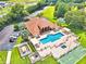 Aerial view of community pool, clubhouse, and shuffleboard at 608 Sweet Bay Cir, Winter Haven, FL 33884