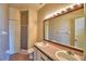 Bathroom with double vanity and a shower stall at 608 Sweet Bay Cir, Winter Haven, FL 33884