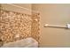 Shower and tub combo with tan tile surround at 608 Sweet Bay Cir, Winter Haven, FL 33884
