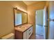 Bathroom with double sinks and access to bedroom at 608 Sweet Bay Cir, Winter Haven, FL 33884